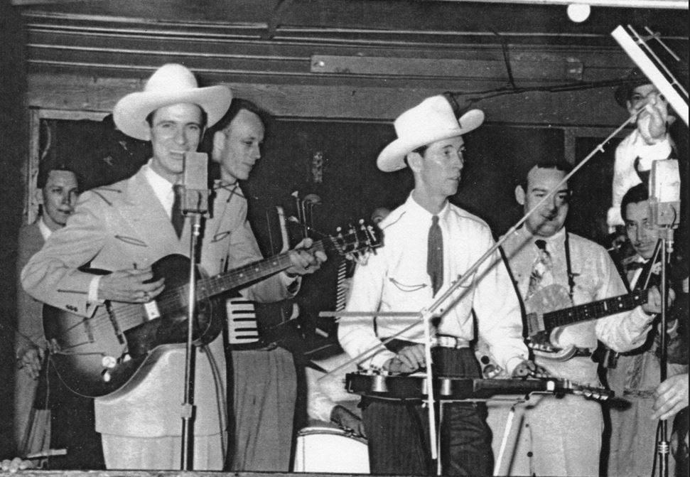 Ernest Tubb & Smiley Whitley Bandera or San Antonio also Butterball Paige (guitar), Emilio Caceres (fiddle at far right).jpg